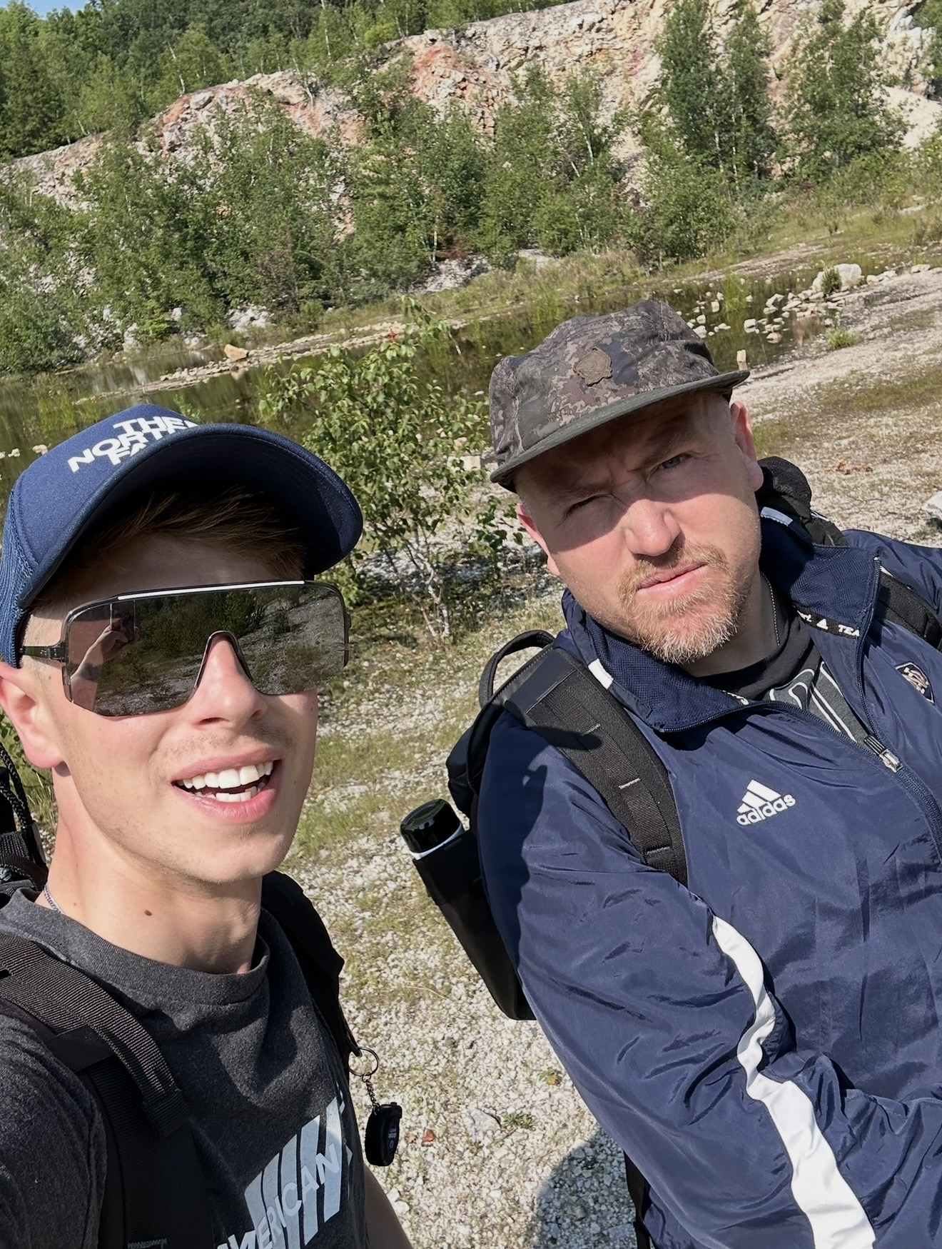 Selfie of Logen and Matt VT out hiking beside a quarry pond