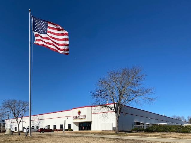 Marathon Cheese Corporation facility with an American flag